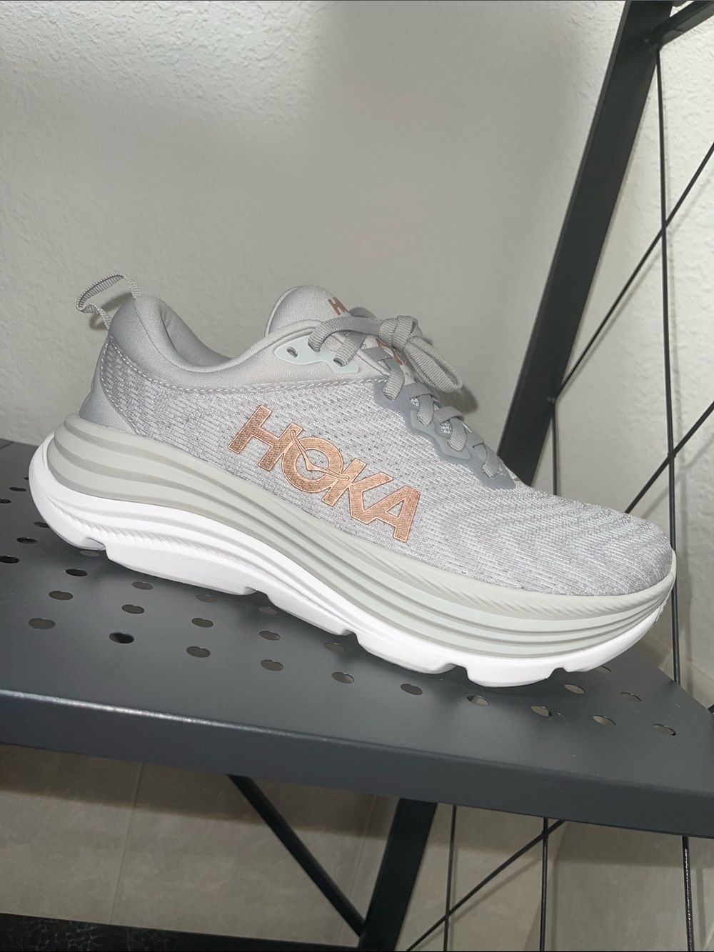 Hoka Women's Light Gray Running Shoe with Rose Gold Logo
